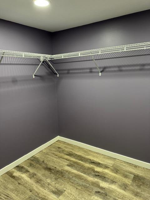 418 N Hemlock St, Evart, MI 49631 - spacious closet featuring wood finished floors