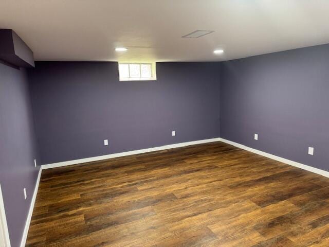 418 N Hemlock St, Evart, MI 49631 - below grade area featuring dark wood-style flooring, baseboards, and recessed lighting