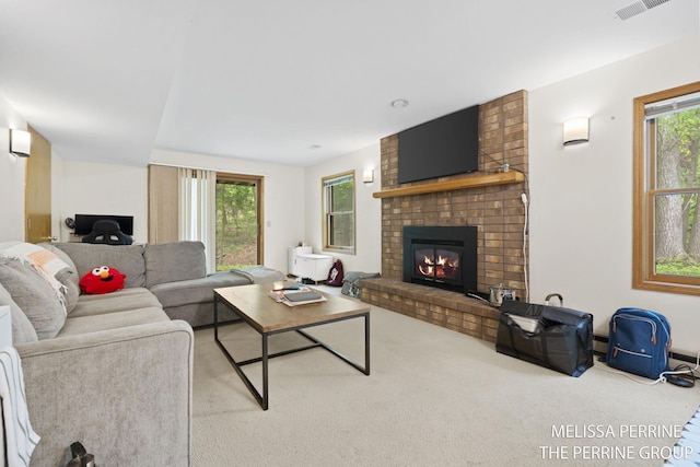 7359 Cascade Woods Dr SE, Grand Rapids, MI 49546 - carpeted living room with a brick fireplace