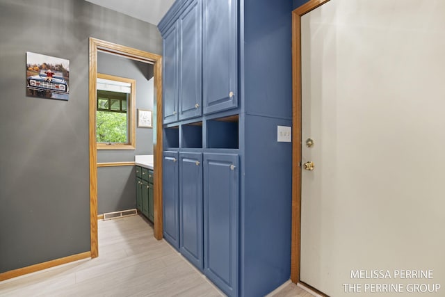 7359 Cascade Woods Dr SE, Grand Rapids, MI 49546 - doorway to outside with light wood-type flooring and baseboards