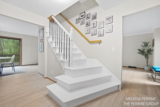 7359 Cascade Woods Dr SE, Grand Rapids, MI 49546 - stairway featuring wood finished floors and baseboards