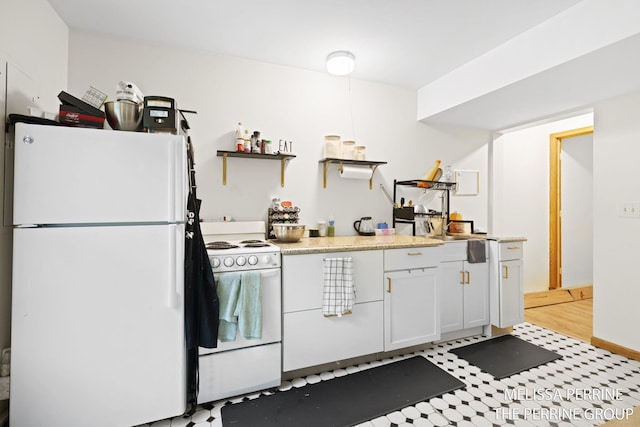7359 Cascade Woods Dr SE, Grand Rapids, MI 49546 - kitchen with white appliances, open shelves, light countertops, white cabinetry, and light floors