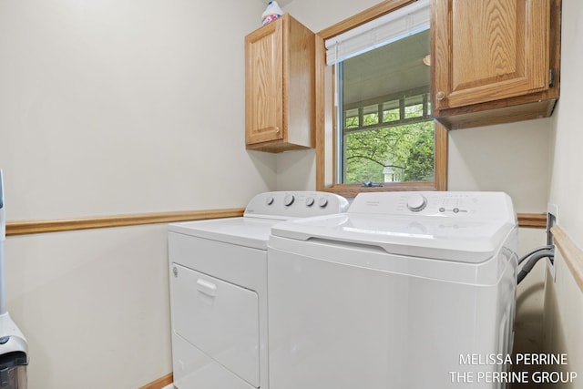 7359 Cascade Woods Dr SE, Grand Rapids, MI 49546 - washroom featuring cabinet space and washing machine and clothes dryer