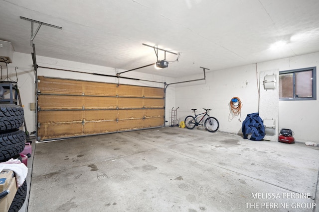 7359 Cascade Woods Dr SE, Grand Rapids, MI 49546 - garage featuring a garage door opener
