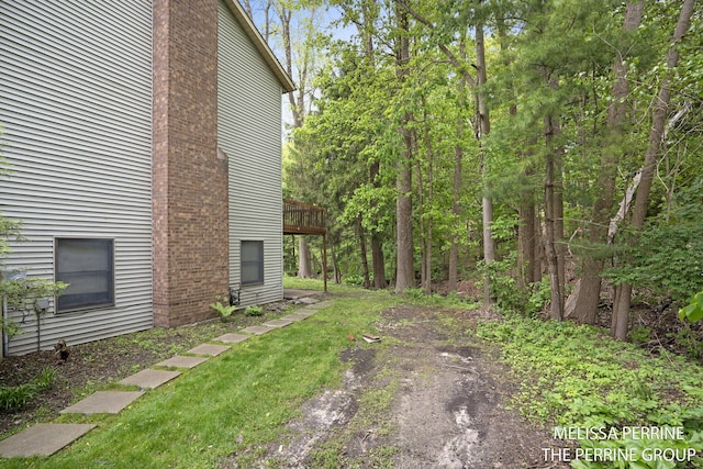 7359 Cascade Woods Dr SE, Grand Rapids, MI 49546 - view of yard with a wooden deck
