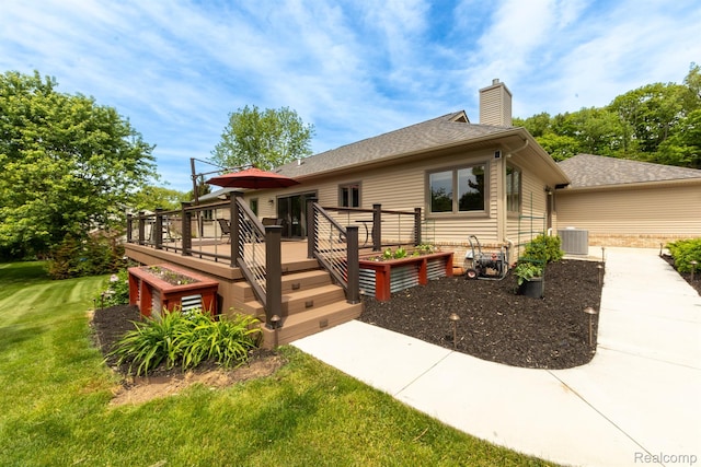 5502 E Alyssa Ct, White Lake, MI 48383 - view of front of property featuring a wooden deck, a front yard, central AC, a chimney, and roof with shingles
