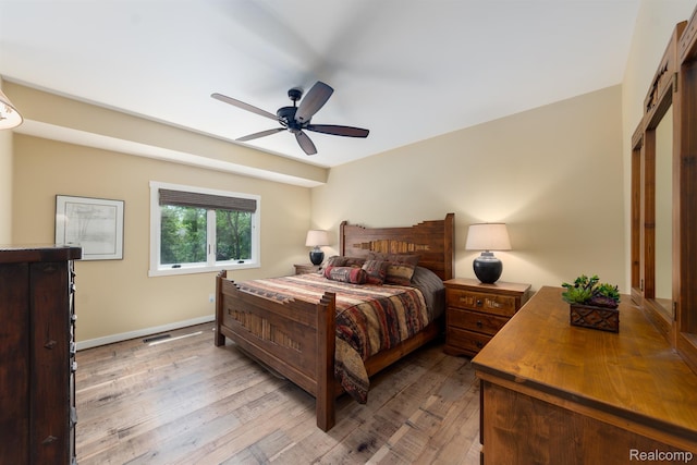 5502 E Alyssa Ct, White Lake, MI 48383 - bedroom featuring hardwood / wood-style flooring, baseboards, and a ceiling fan