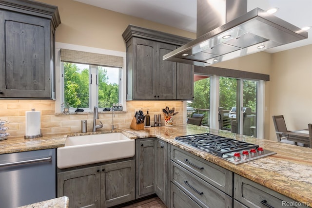 5502 E Alyssa Ct, White Lake, MI 48383 - kitchen featuring wall chimney exhaust hood, stainless steel appliances, a sink, and plenty of natural light