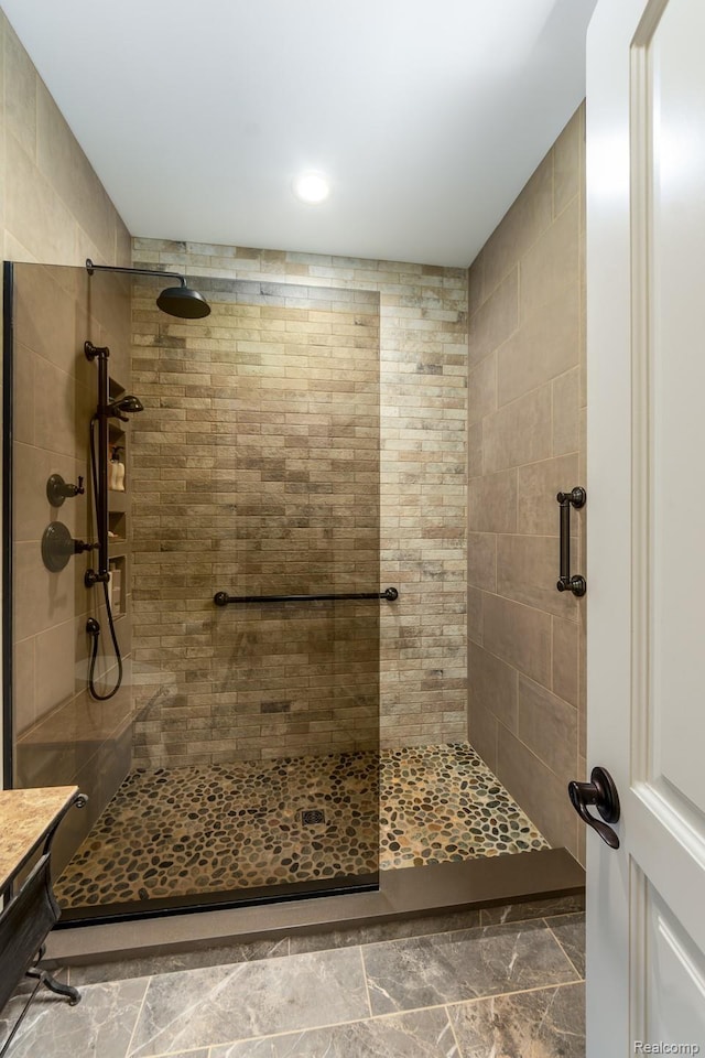 5502 E Alyssa Ct, White Lake, MI 48383 - bathroom featuring a tile shower and recessed lighting