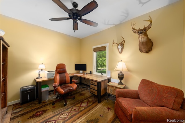 5502 E Alyssa Ct, White Lake, MI 48383 - home office with wood finished floors, a ceiling fan, and baseboards