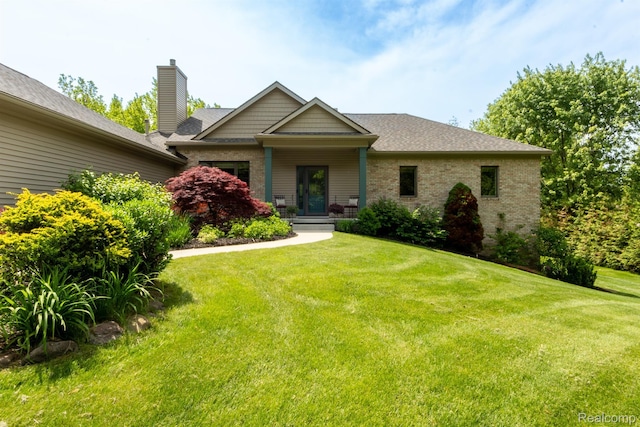 5502 E Alyssa Ct, White Lake, MI 48383 - craftsman-style house featuring brick siding, a front lawn, a chimney, and roof with shingles