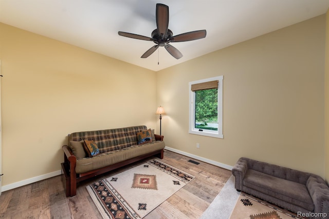 5502 E Alyssa Ct, White Lake, MI 48383 - living room featuring wood finished floors, baseboards, and a ceiling fan