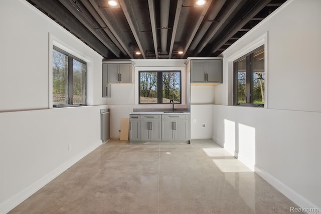 4030 Metamora Rdg, Metamora, MI 48455 - unfurnished dining area with a sink, plenty of natural light, and concrete floors