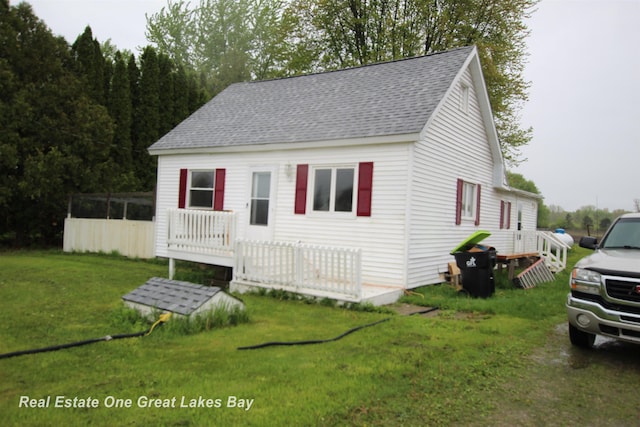 4141 Sagatoo Rd, Standish, MI 48658 - cape cod home with roof with shingles and a front yard