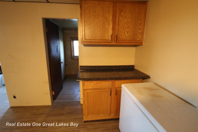 4141 Sagatoo Rd, Standish, MI 48658 - kitchen featuring dark wood finished floors, range, and dark countertops