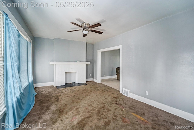9419 Ravenswood St, Detroit, MI 48204 - unfurnished living room featuring a ceiling fan, a brick fireplace, carpet floors, and baseboards