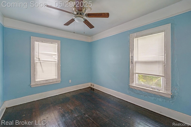 9419 Ravenswood St, Detroit, MI 48204 - unfurnished room with dark wood-style flooring, plenty of natural light, and baseboards