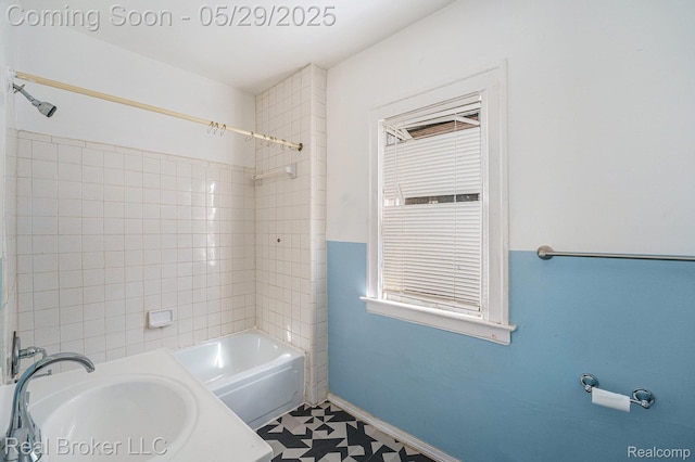 9419 Ravenswood St, Detroit, MI 48204 - full bath featuring washtub / shower combination, vanity, baseboards, and tile patterned floors