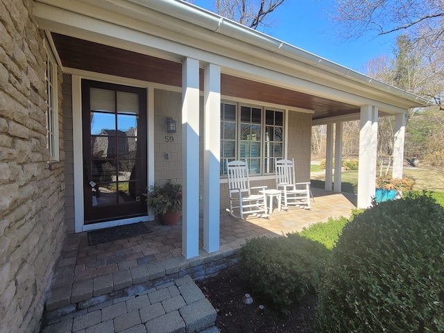 59 Scenic Oaks Dr S, Bloomfield Hills, MI 48304 - doorway to property featuring covered porch