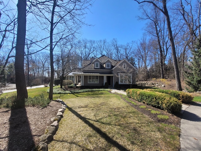 59 Scenic Oaks Dr S, Bloomfield Hills, MI 48304 - view of front facade featuring a front yard and a porch
