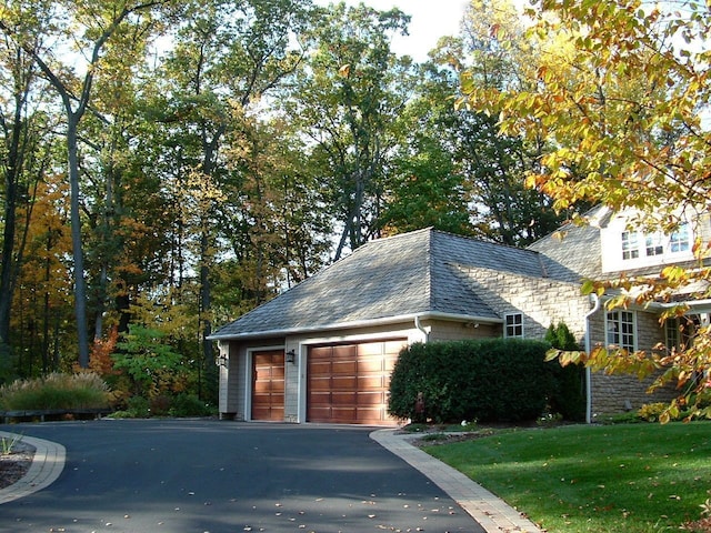 59 Scenic Oaks Dr S, Bloomfield Hills, MI 48304 - view of property exterior with a high end roof, stone siding, and a lawn