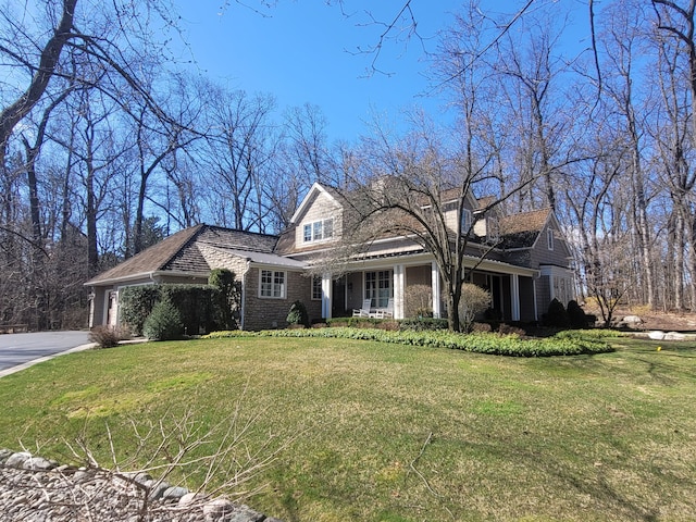 59 Scenic Oaks Dr S, Bloomfield Hills, MI 48304 - view of front of property with a front yard, driveway, and a porch