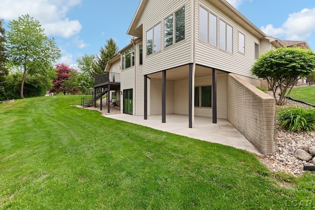 3079 Windmill Ct, Adrian, MI 49221 - rear view of property with stairway, a patio area, a lawn, and a wooden deck