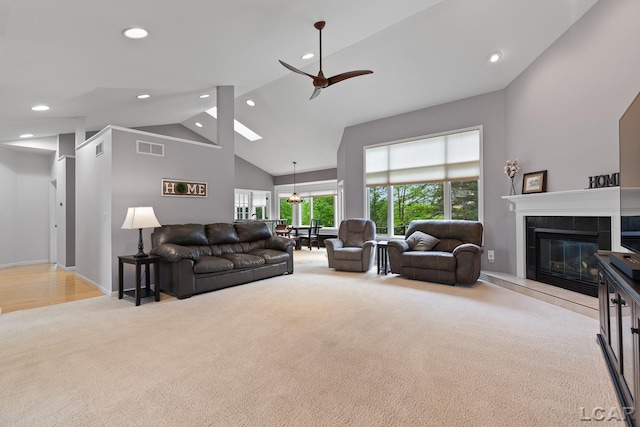 3079 Windmill Ct, Adrian, MI 49221 - carpeted living area featuring high vaulted ceiling, ceiling fan, recessed lighting, and a fireplace