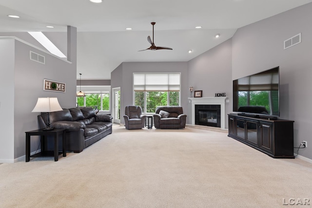3079 Windmill Ct, Adrian, MI 49221 - living area with carpet floors, high vaulted ceiling, baseboards, recessed lighting, and a fireplace