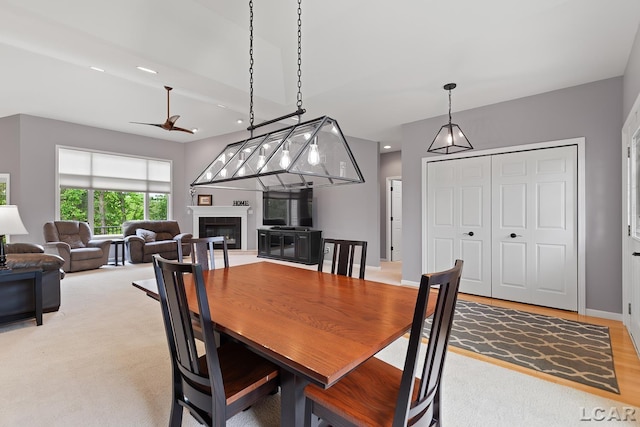 3079 Windmill Ct, Adrian, MI 49221 - dining space with ceiling fan, a glass covered fireplace, and recessed lighting