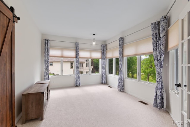 3079 Windmill Ct, Adrian, MI 49221 - unfurnished sunroom featuring a barn door