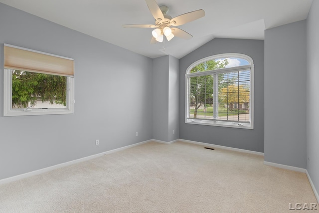 3079 Windmill Ct, Adrian, MI 49221 - carpeted spare room featuring a ceiling fan, lofted ceiling, and baseboards