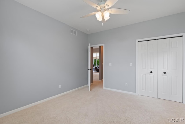 3079 Windmill Ct, Adrian, MI 49221 - unfurnished bedroom featuring light carpet, baseboards, a closet, and ceiling fan