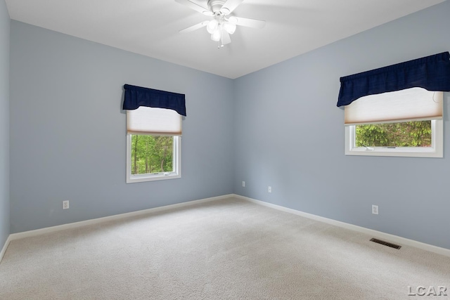 3079 Windmill Ct, Adrian, MI 49221 - carpeted spare room featuring a ceiling fan, baseboards, and plenty of natural light