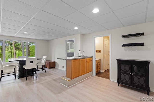3079 Windmill Ct, Adrian, MI 49221 - kitchen with light wood-style floors, a drop ceiling, baseboards, a sink, and recessed lighting