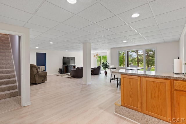 3079 Windmill Ct, Adrian, MI 49221 - living area featuring stairway, light wood-style flooring, a drop ceiling, and recessed lighting