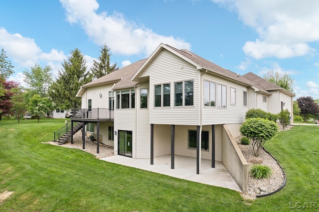 3079 Windmill Ct, Adrian, MI 49221 - rear view of property with stairway, a patio area, a deck, and a yard