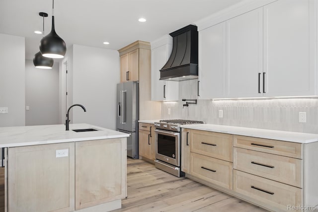4075 Metamora Rdg, Metamora, MI 48455 - kitchen with stainless steel appliances, light brown cabinetry, custom range hood, a sink, and light wood finished floors
