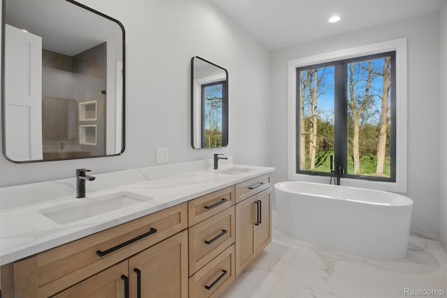 4075 Metamora Rdg, Metamora, MI 48455 - bathroom with marble finish floors, double vanity, a freestanding bath, healthy amount of natural light, and recessed lighting