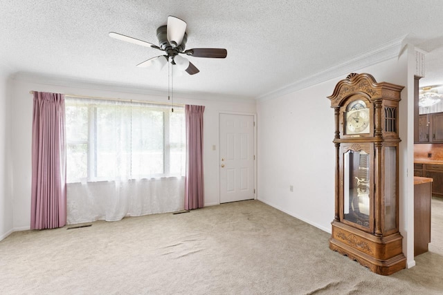 12310 Seymour Rd, Montrose, MI 48457 - carpeted spare room featuring a ceiling fan, ornamental molding, and a textured ceiling