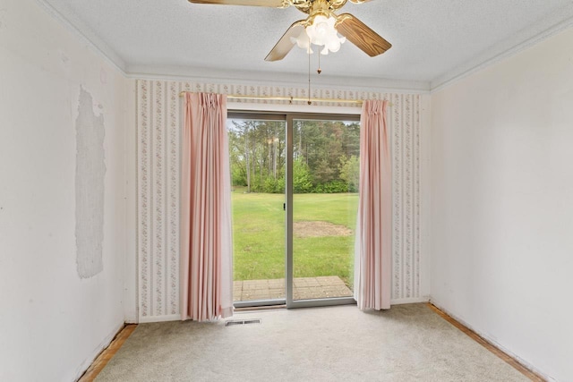 12310 Seymour Rd, Montrose, MI 48457 - unfurnished room with ornamental molding, ceiling fan, a textured ceiling, wallpapered walls, and carpet floors