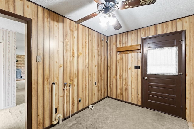 12310 Seymour Rd, Montrose, MI 48457 - carpeted spare room with wood walls, a ceiling fan, and a textured ceiling