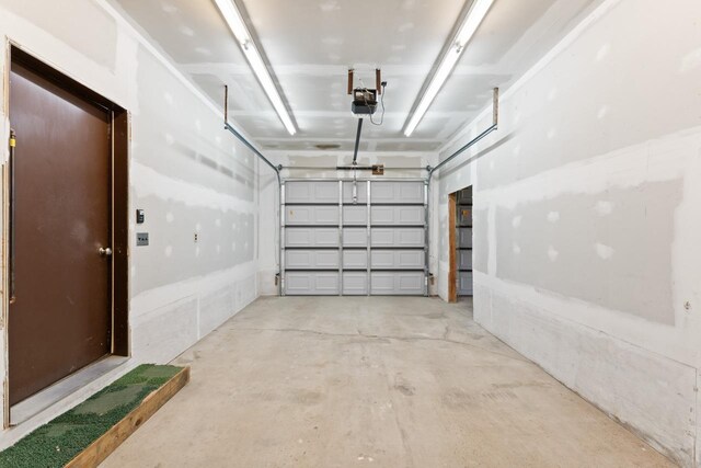 12310 Seymour Rd, Montrose, MI 48457 - garage featuring a garage door opener