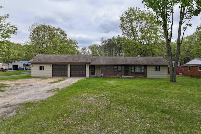 12310 Seymour Rd, Montrose, MI 48457 - ranch-style home with an attached garage, driveway, and a front lawn