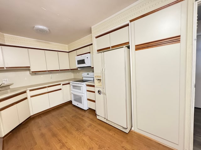 3 Colony Ln, Dearborn, MI 48120 - kitchen with white appliances, light wood-style flooring, and white cabinets