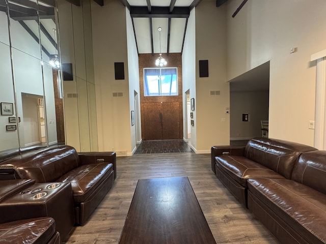 3 Colony Ln, Dearborn, MI 48120 - living area with a high ceiling, wood finished floors, and baseboards