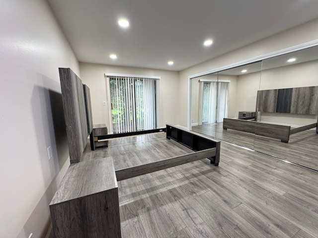 3 Colony Ln, Dearborn, MI 48120 - unfurnished living room with wood finished floors, recessed lighting, and baseboards