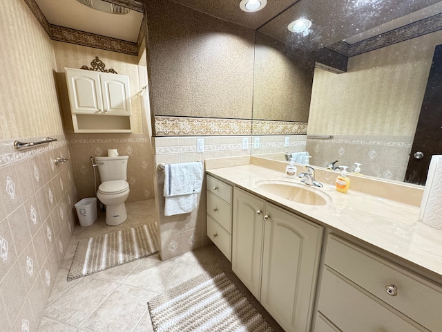 3 Colony Ln, Dearborn, MI 48120 - full bath with tile patterned flooring, vanity, toilet, tile walls, and recessed lighting