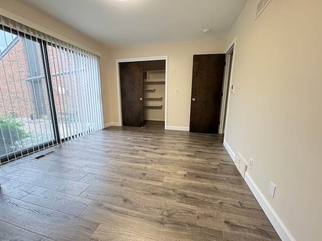 3 Colony Ln, Dearborn, MI 48120 - spare room featuring plenty of natural light, wood finished floors, and baseboards