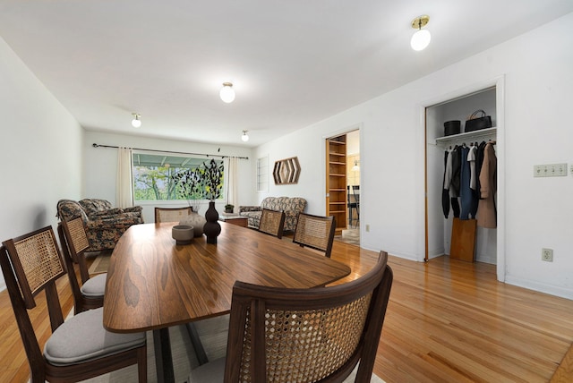 10827 N 12th St, Plainwell, MI 49080 - dining area featuring light wood-type flooring and baseboards